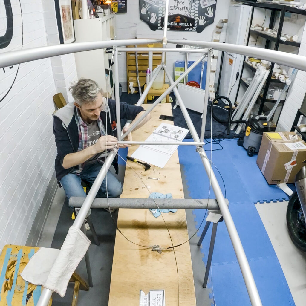 Attaching the bracing cables to the rear fuselage